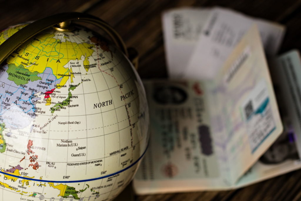 World Globe focused on Japan with passport and tickets